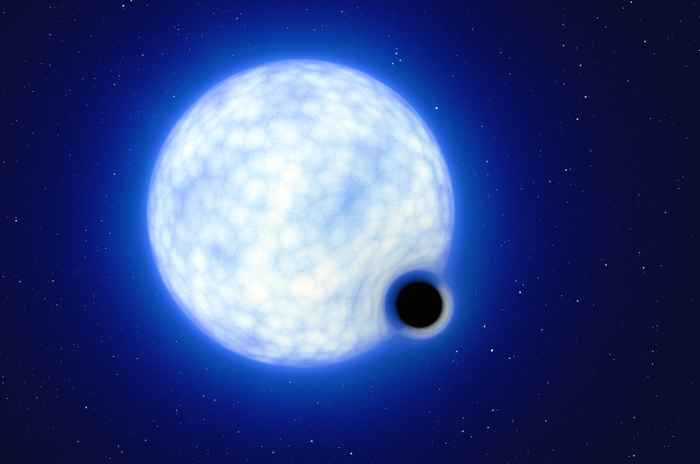 Artistieke weergave van het dubbelstersysteem met een grote lichtblauwe ster in het midden en een zwarte ster met een kring er omheen die het zwarte gat moet voorstellen ongeveer rechts onder, iets overlappend op de ster