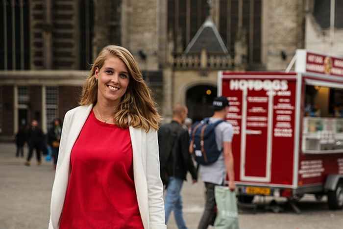 Alumna with red and white top, outside picture