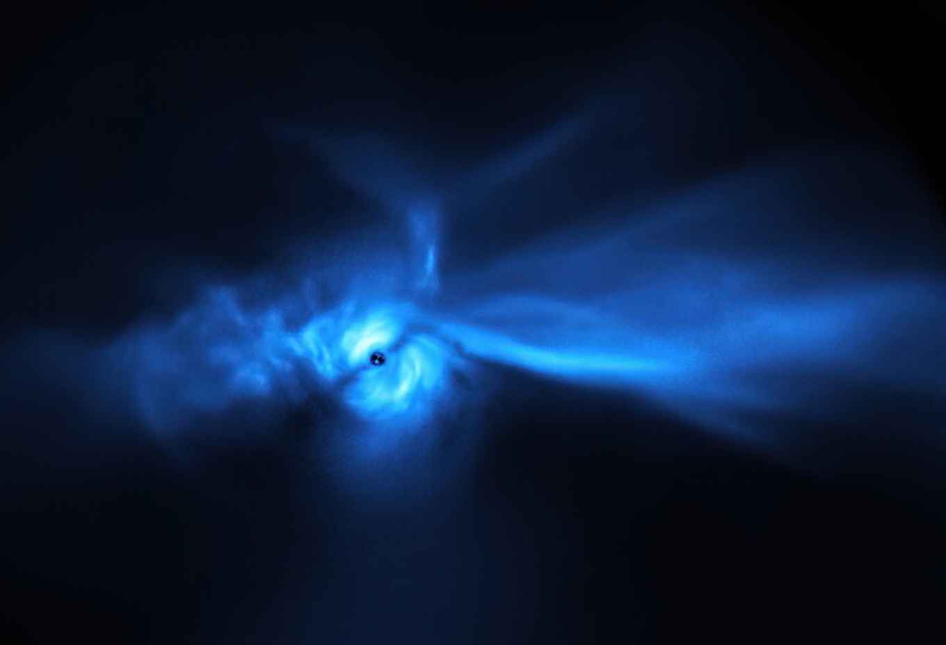 A blue irregular nebula (resembling a bird) around a star-forming disk