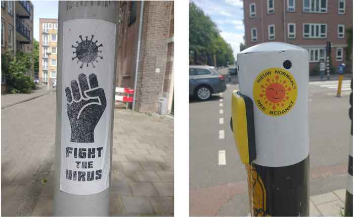 twee paaltjes met twee verschillende posters: 'Fight the virus' en 'Nieuw normaal. Nee, bedankt'