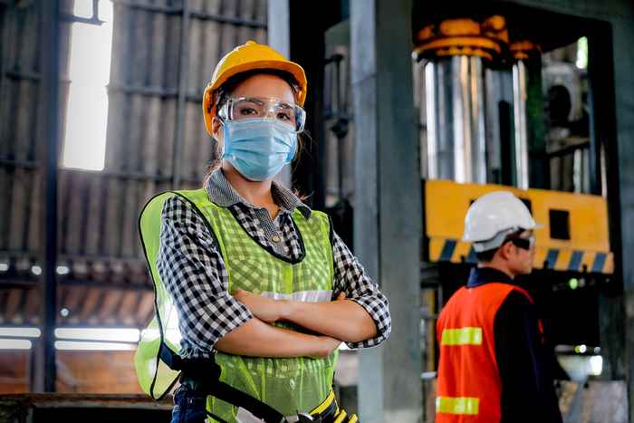 female employee standing in factory