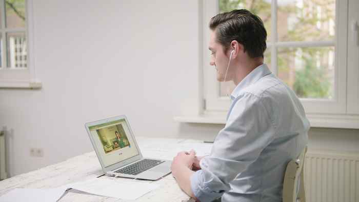 A medical student talking to a virtual patient