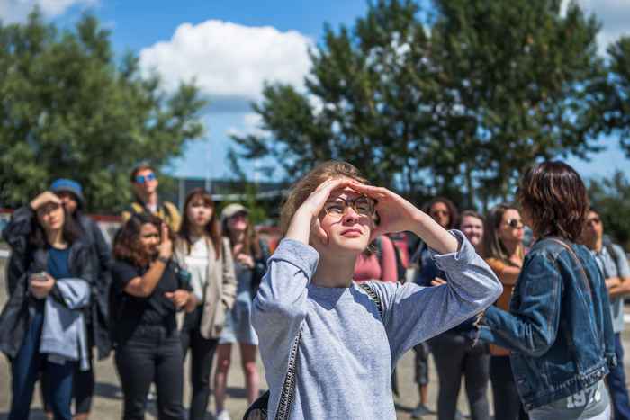 Girl looking into the sun