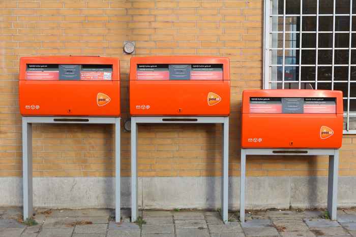 3 Dutch orange mailboxes